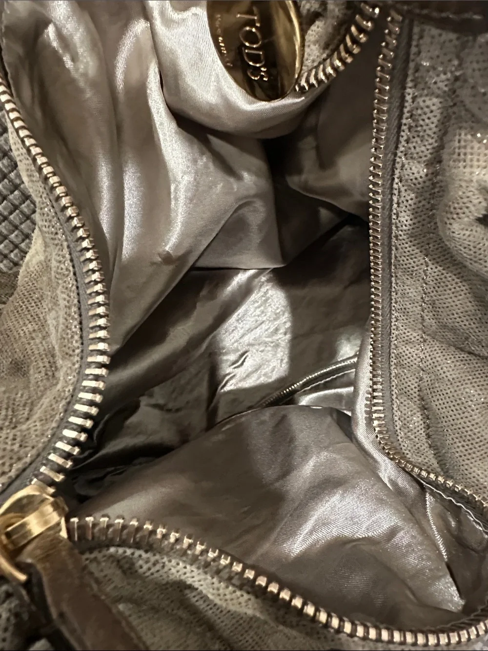 Tod’s Soft Metallic Taupe Hobo Bag with Gold Hardware. Lots of pockets,